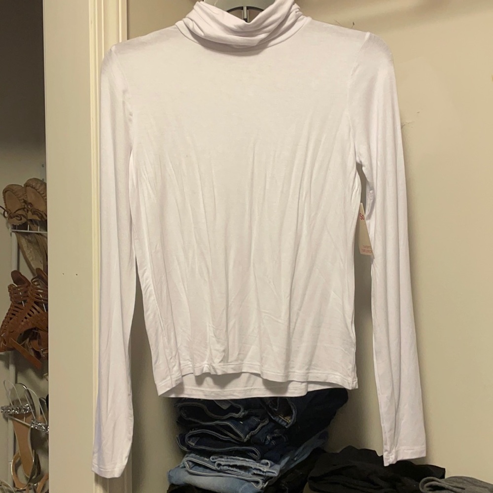 So, super soft white turtleneck, size S.